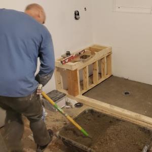 Eagle Eye Stone & Tile employee laying the foundation for a Tile Project in the Port Huron area