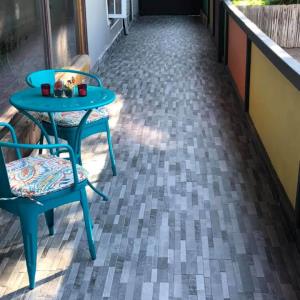 Grey Tile Floor Installed on Patio